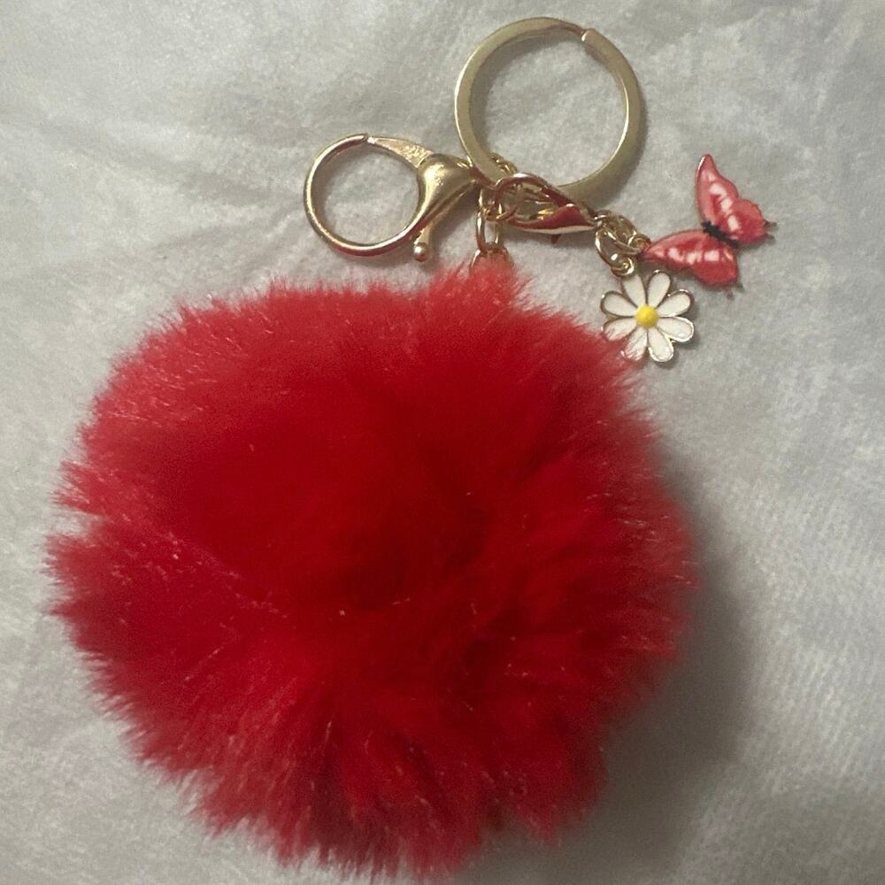 Red pom-pom with daisy flower and butterfly charm/key chain. Brand New